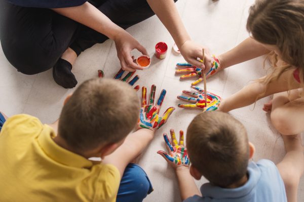 teacher works with children according to the Montessori method a